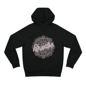 The Breathe Hoodie is a black hoodie featuring a bold mandala design on the back, with breathe written in elegant cursive at the center.