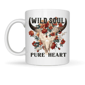 The Wild Soul Pure Heart Floral Bull Skull Mug features a white base with red and pink flowers, WILD SOUL above the skull and PURE HEART below. Perfect to pair with your favorite slate keyring for a unique touch.