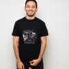 Pisces Fish Tshirt A smiling man stands against a plain light wall, wearing the Pisces Fish Tshirt with an artistic zodiac design and PISCES in gold letters below.