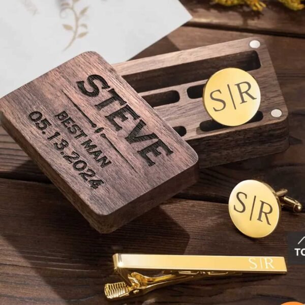 Men's 4Pcs/ Set Leather Bracelets A wooden box engraved with STEVE, BEST MAN, 05.13.2024 sits beside the Personalised Cufflinks and Tie Clip Gift Set, both engraved with S|R, on a wooden surface—an elegant personalised gift for special occasions.