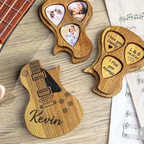 The Personalised Guitar Picks With Case is a wooden, guitar-shaped box engraved with Kevin, opening to reveal three photo slots and three heart-shaped messages: I love you Daddy, I pick you always, and L&B 09.22.