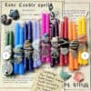 Small Intention Spell Candles, paired with crystals and charms, are arranged atop a Love Candle Spell paper featuring mystical symbols, a spell recipe, and candle magic meanings in the background.