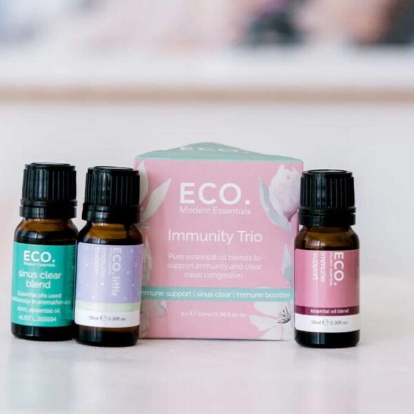 Aries Zodiac Essential Oil Blend Three small bottles from the Immune Booster Essential Oil Trio Pack are displayed on a white surface, showcasing their immune-boosting blends against a blurred background.