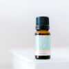 ECO Little Study Time Essential Oil Blend A small amber glass bottle with a black cap labeled ECO Little Study Time Essential Oil Blend is placed on a white surface against a blurred white background.