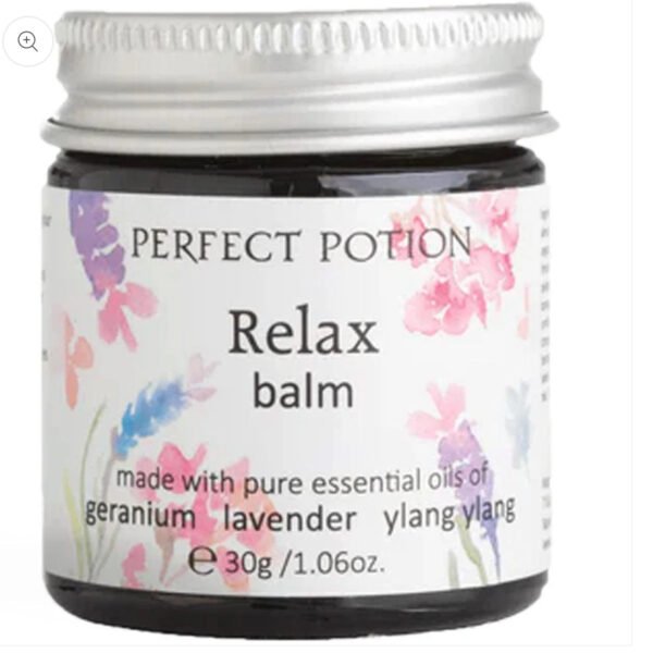 A 30g jar of Perfect Potion Relax Balm, featuring pastel floral designs and a label highlighting pure geranium, lavender, and ylang ylang essential oils.