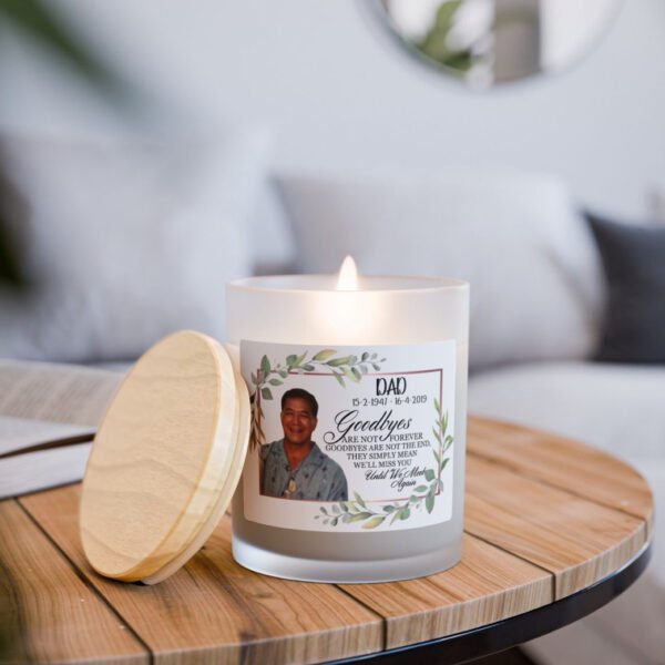 The Custom Memorial Candle – Personalised Photo & Quote | 11oz Frosted Glass Wood Wick Candle rests on a wooden table, its gentle glow adding warmth and comfort to the room—a heartfelt tribute in elegant, personalised form.