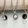 A collection of Custom Moon Phase Necklaces, each capturing your favorite lunar moment with stunning moon imagery.