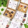 Zodiac crystal gift sets with tumbled stones, selenite wand and star sign guide cards, beautifully packaged in boxes for astrology and spiritual gifting by Kjahli